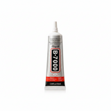 Three squeeze tubes of King shi B-7000 adhesive in 25ml, 50ml, and 110ml sizes, arranged from smallest to largest on a light surface with a soft beige background and decorative dried stems and fabric.